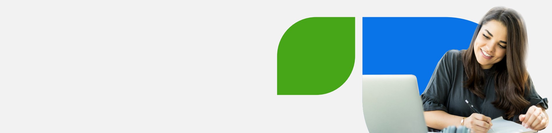 Image of a female student taking notes from a laptop