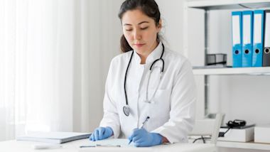 hand typing on keyboard