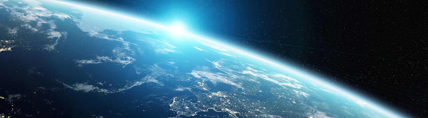 View of Earth's curved horizon from space showing the Mediterranean region with bright sunlight and blue atmosphere