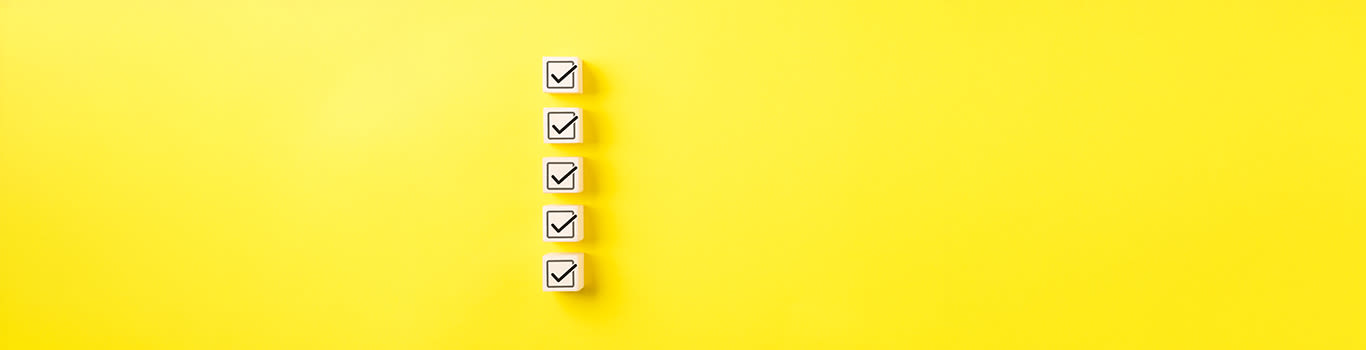 Checklist concept, yellow background, checks in boxes
