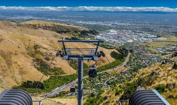 An aerial view of Christchurch from the top of the mountain as cable cars glide down the valley