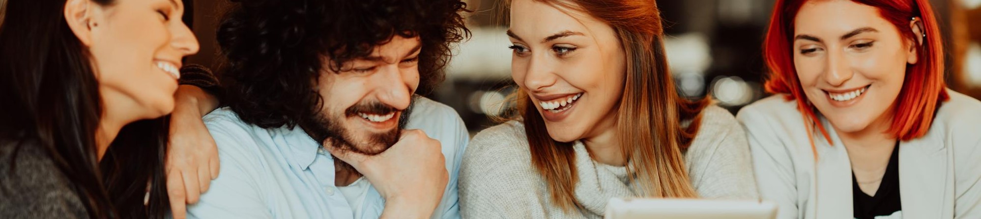 four students smiling