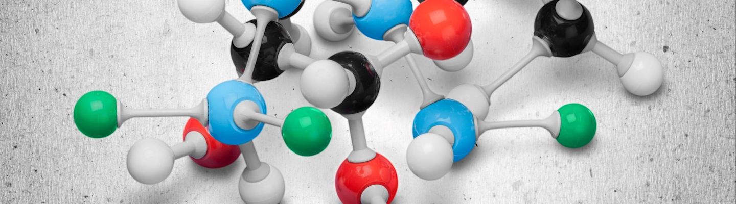 A female student holding a molecular structure