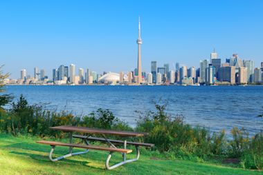 A view of tall buildings in front of a lake in Canada.