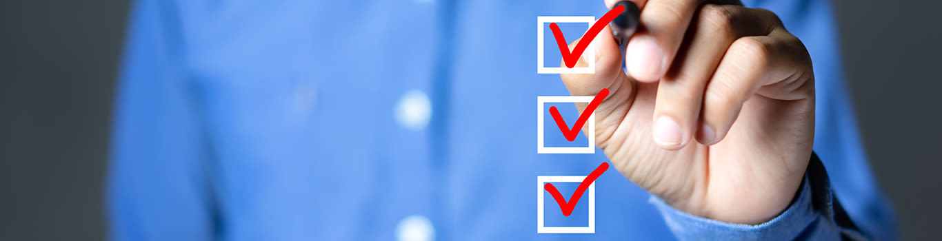 Person checking off boxes from a list