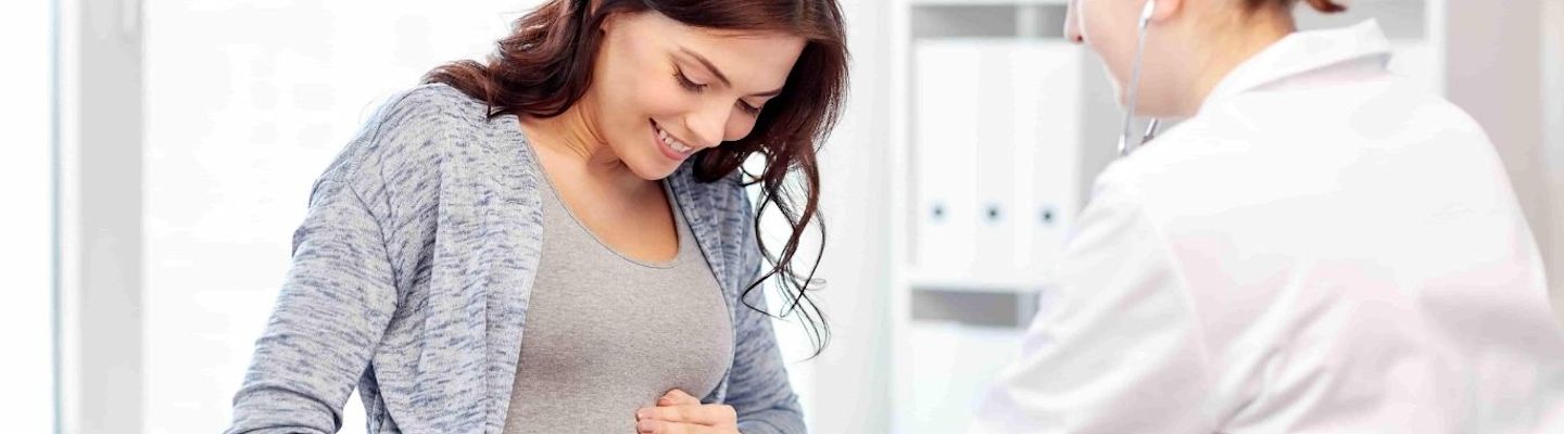 A Gynecologist checking a pregnant women