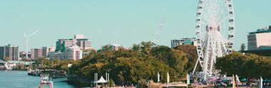 landscape of city with ferris wheel