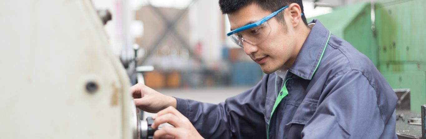 An automotive technician is working