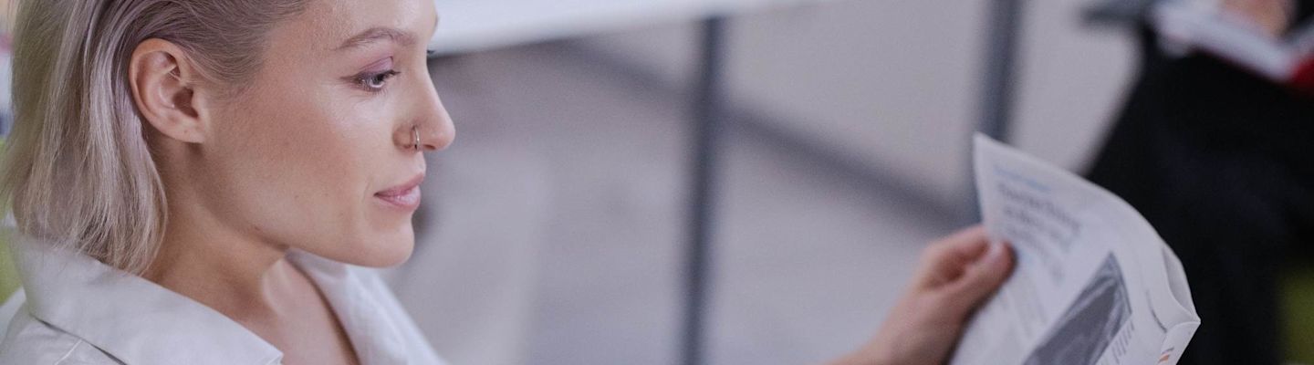 A women reading a newspaper