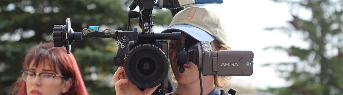 A Mass Communication student with a video camera