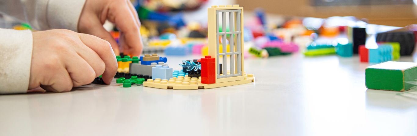 A picture of a child playing with blocks