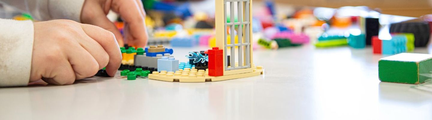 A picture of a child playing with blocks