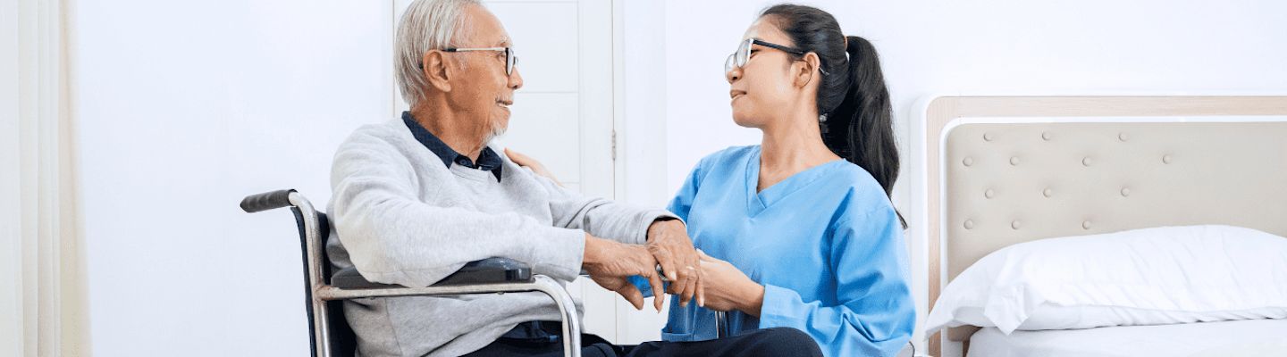 A medical student checking on elderly patient health