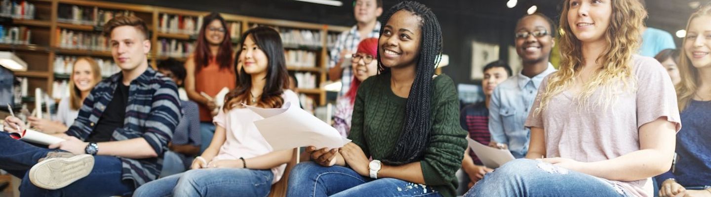 A group of IDP students together in a classroom