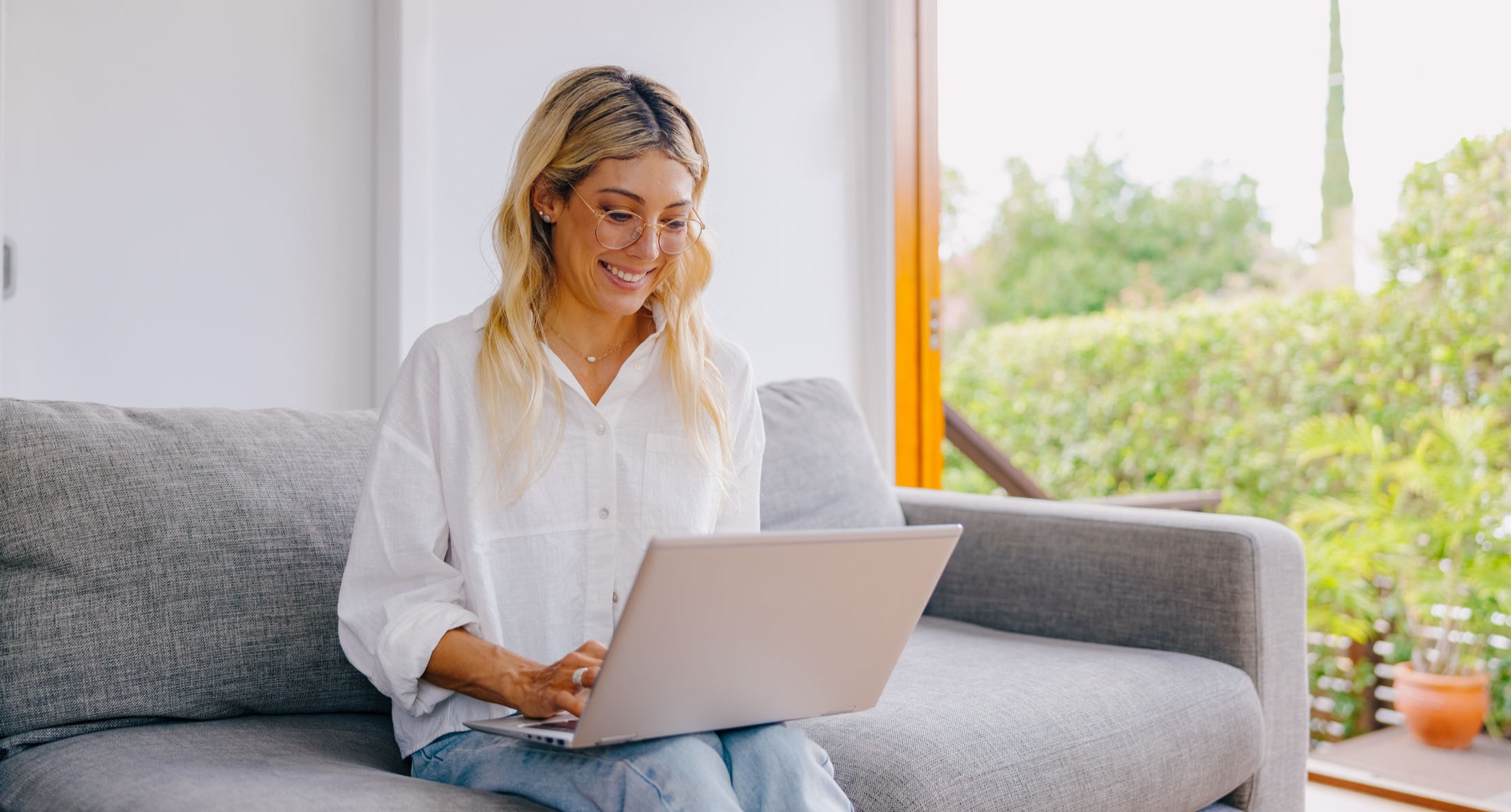 a test taker sitting with a laptop