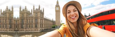 A woman taking selfie near London Clock Tower