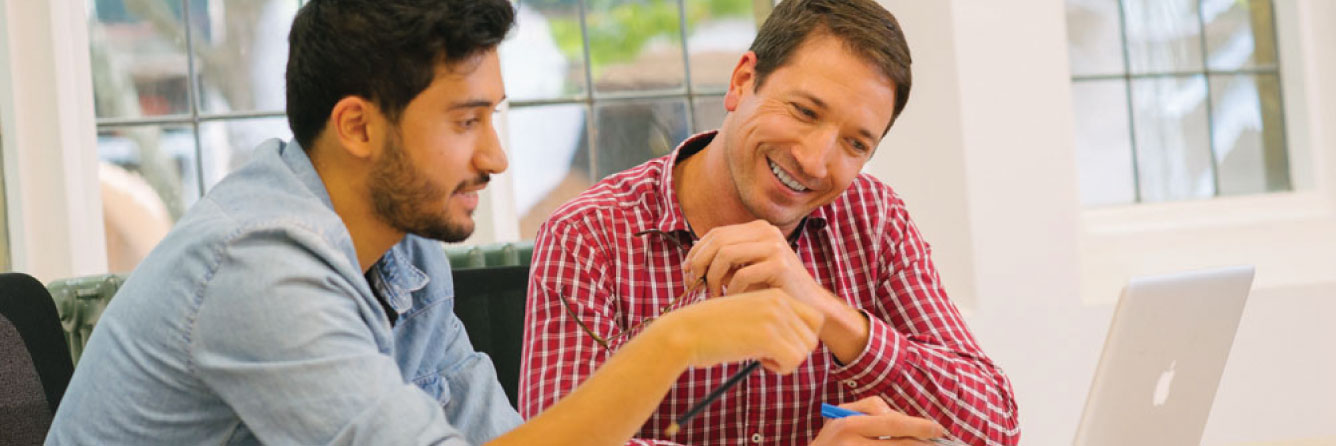 Two male students discussing 