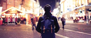A male looking at the busy street 
