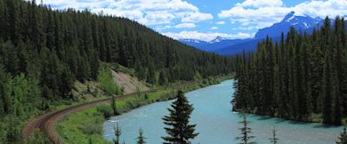A scenic view of the mountains and river in Canada