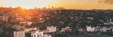 An aerial view of a city in Australia during sunrise
