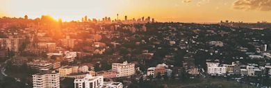 An aerial view of a city in Australia during sunrise