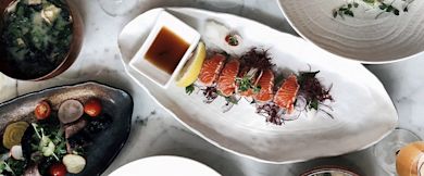 Different Japanese food plated on a table, including sushi.