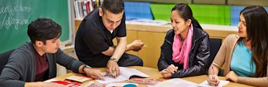 A group of international students studying in a classroom