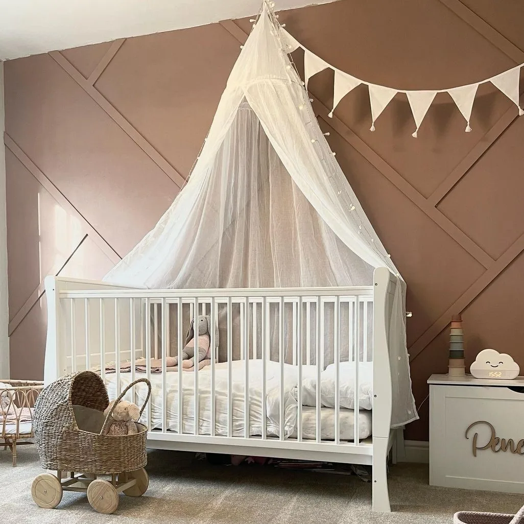 Baby bedroom with cot and toys
