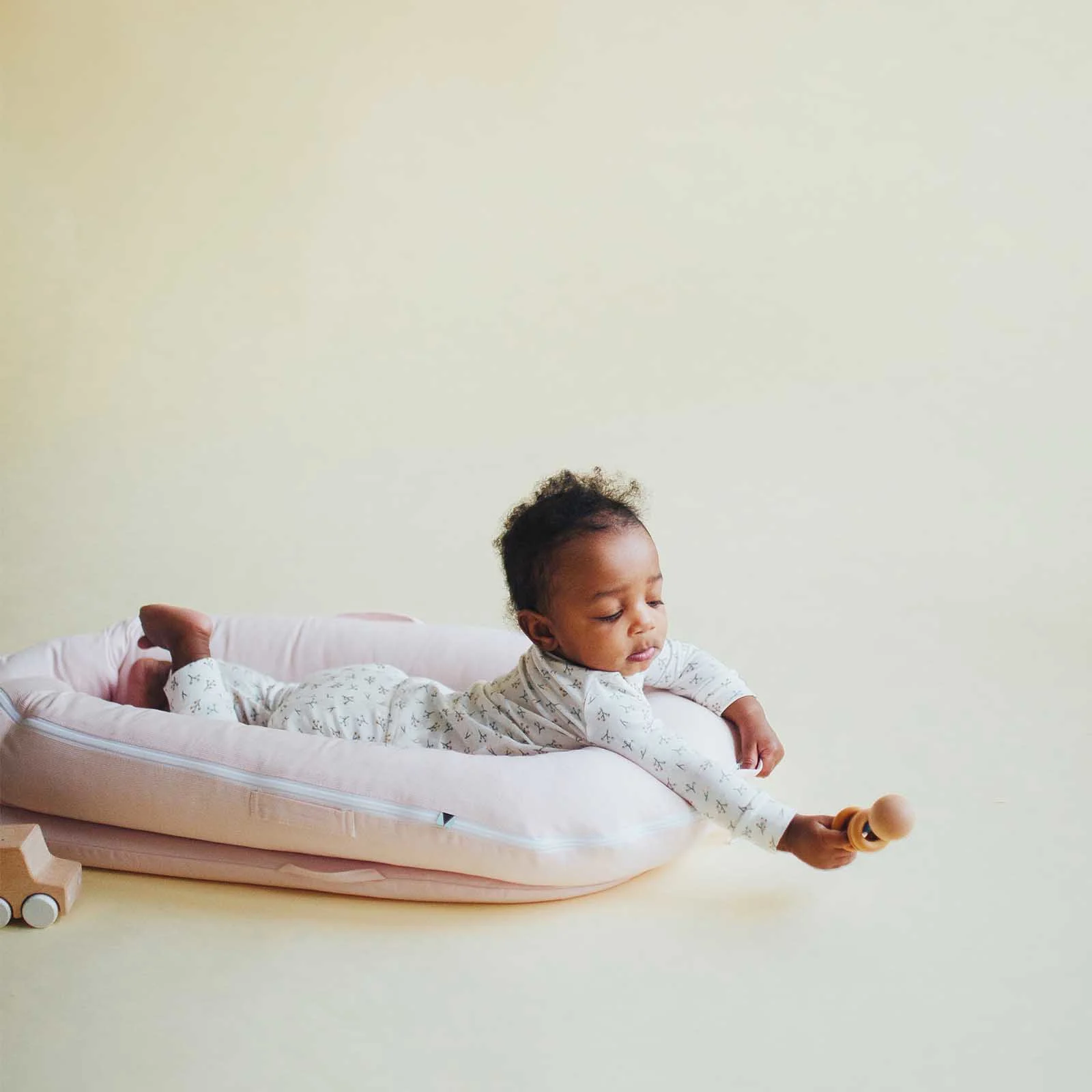 DockATot Deluxe+ Dock – Strawberry Cream | The Nursery Store