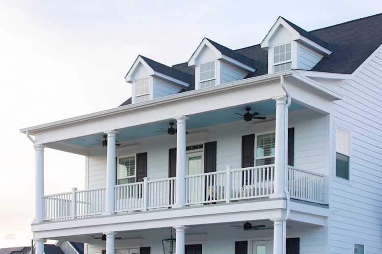 beautiful white home with siding that was repaired by Colorado Siding Repair