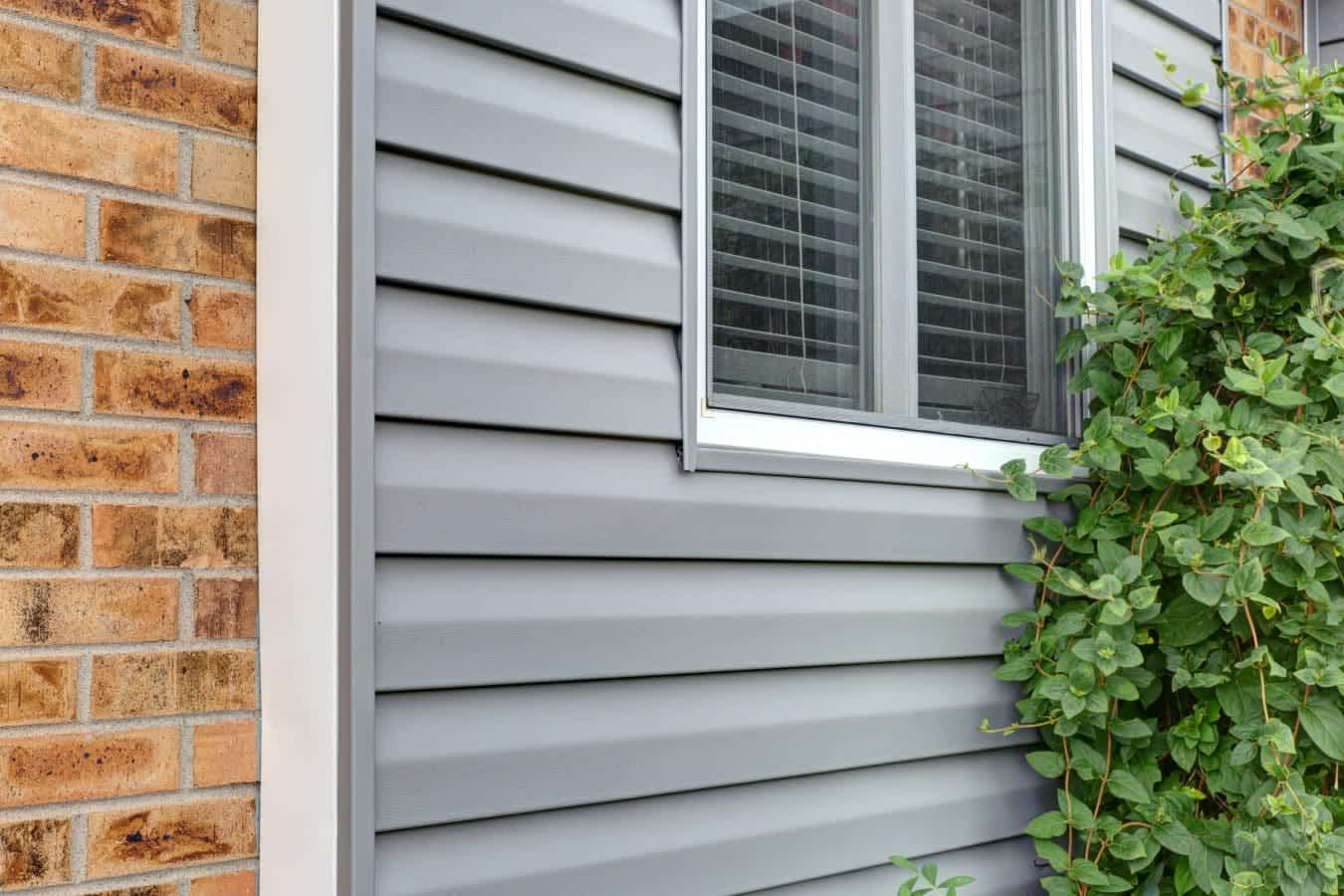 house with gray vinyl siding installed by Colorado Siding Repair