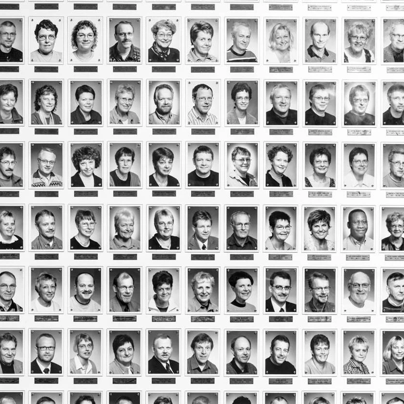 The long wall of images of employees that have worked for B&O more than 25 years
