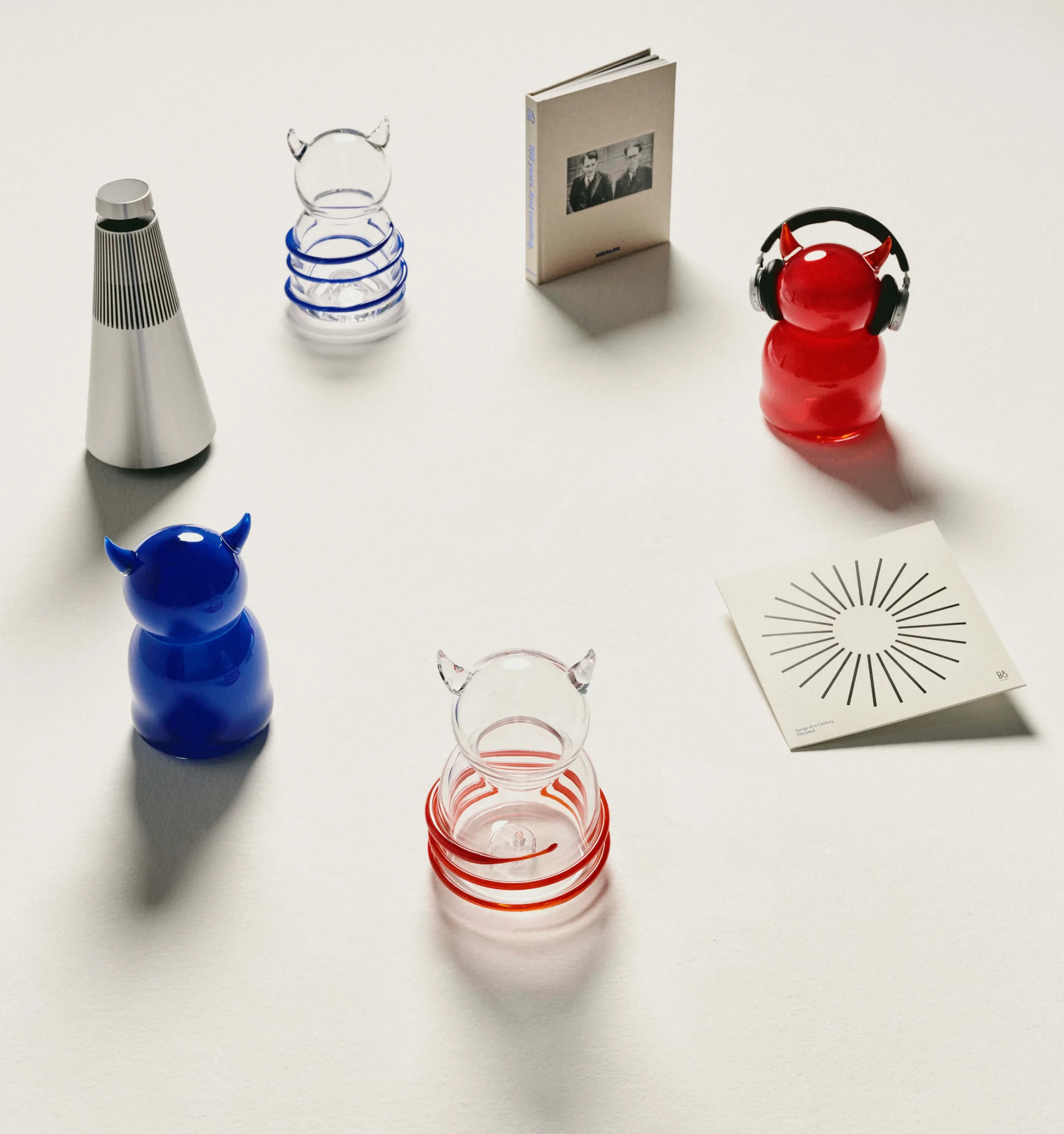 Four glass figures and 3 B&O products