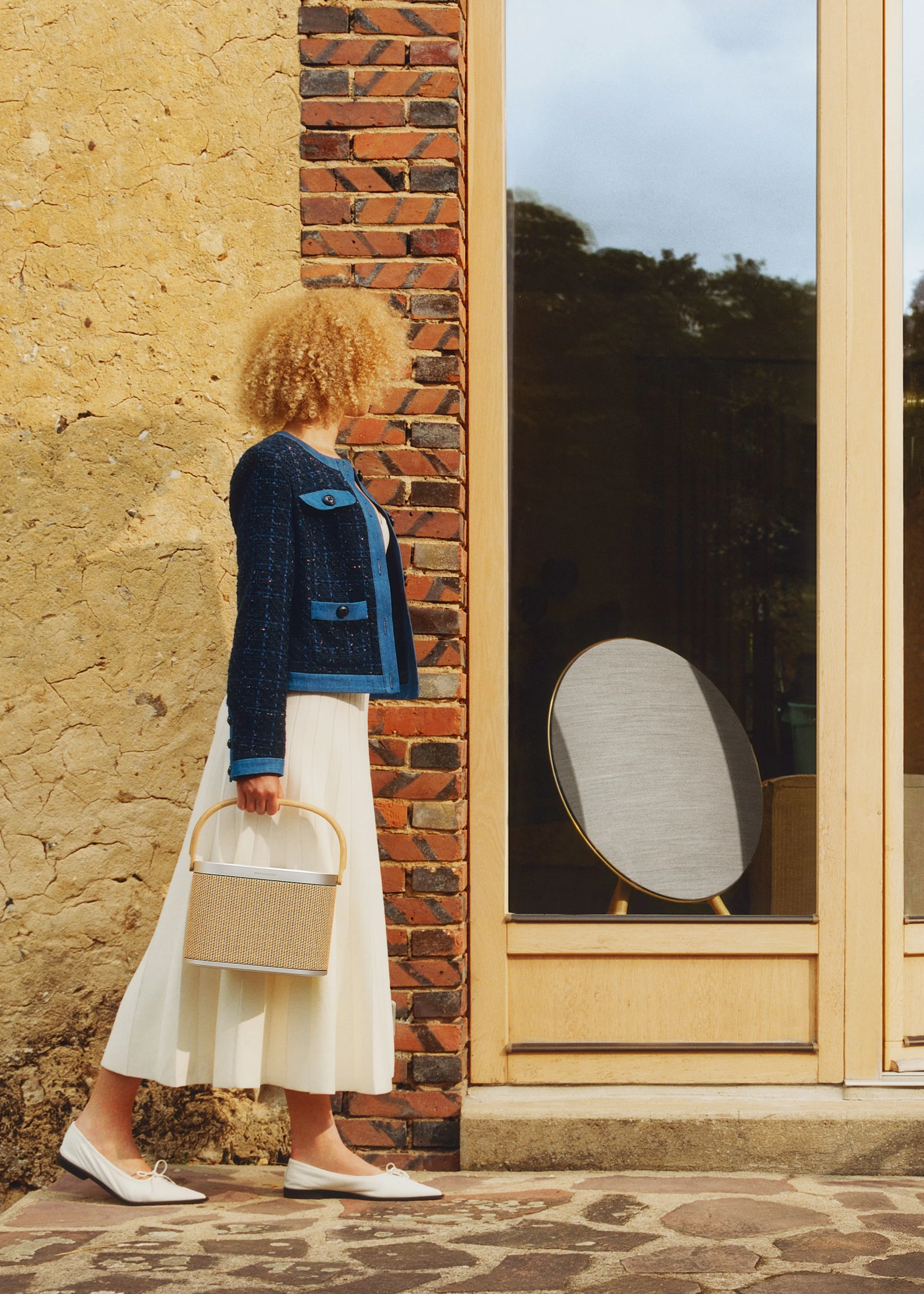 Beosound A9 viewed from the yard through a window