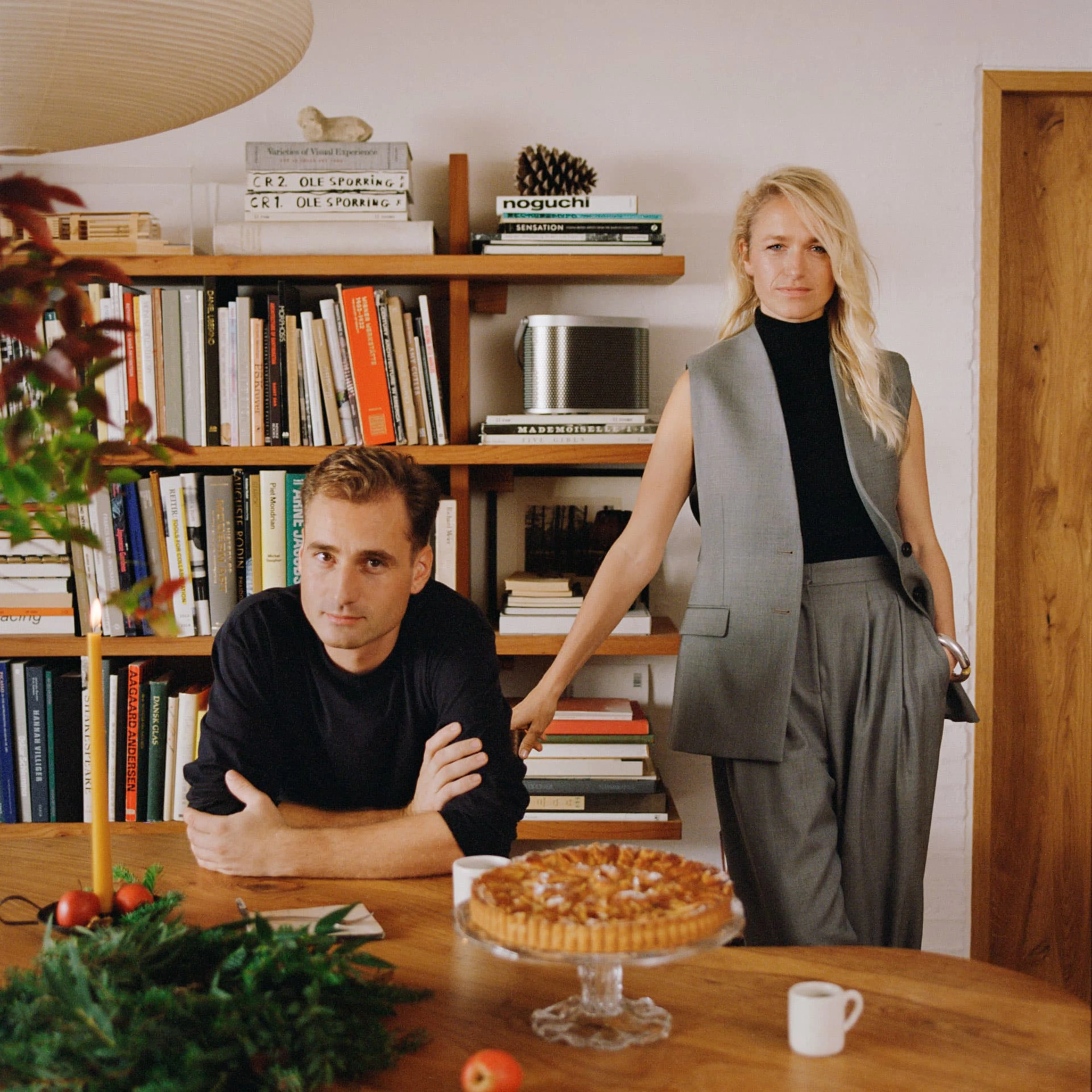 Image of danish architect Malene Hvidt and designer Nikolaj Lorentz in their living room with a Beosound A5 speaker in the background