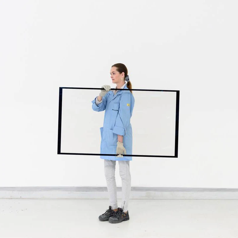 Woman carrying a tv screen