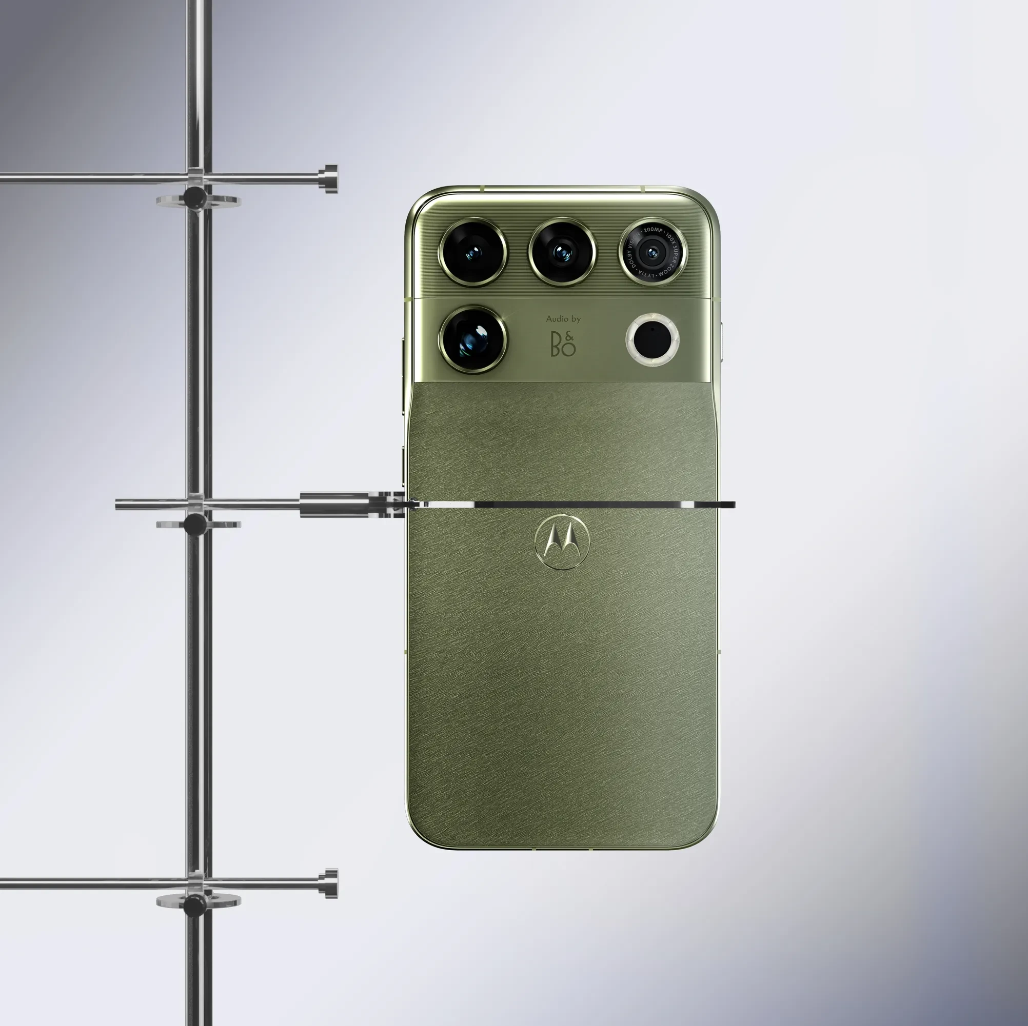 Motorola Edge smartphone in green, featuring Audio by Bang & Olufsen branding, with a quad-camera array