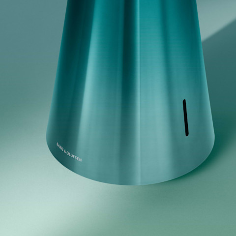 Image of the lower part of a Beosound 2 speaker in the colour Northern sky Turqouise