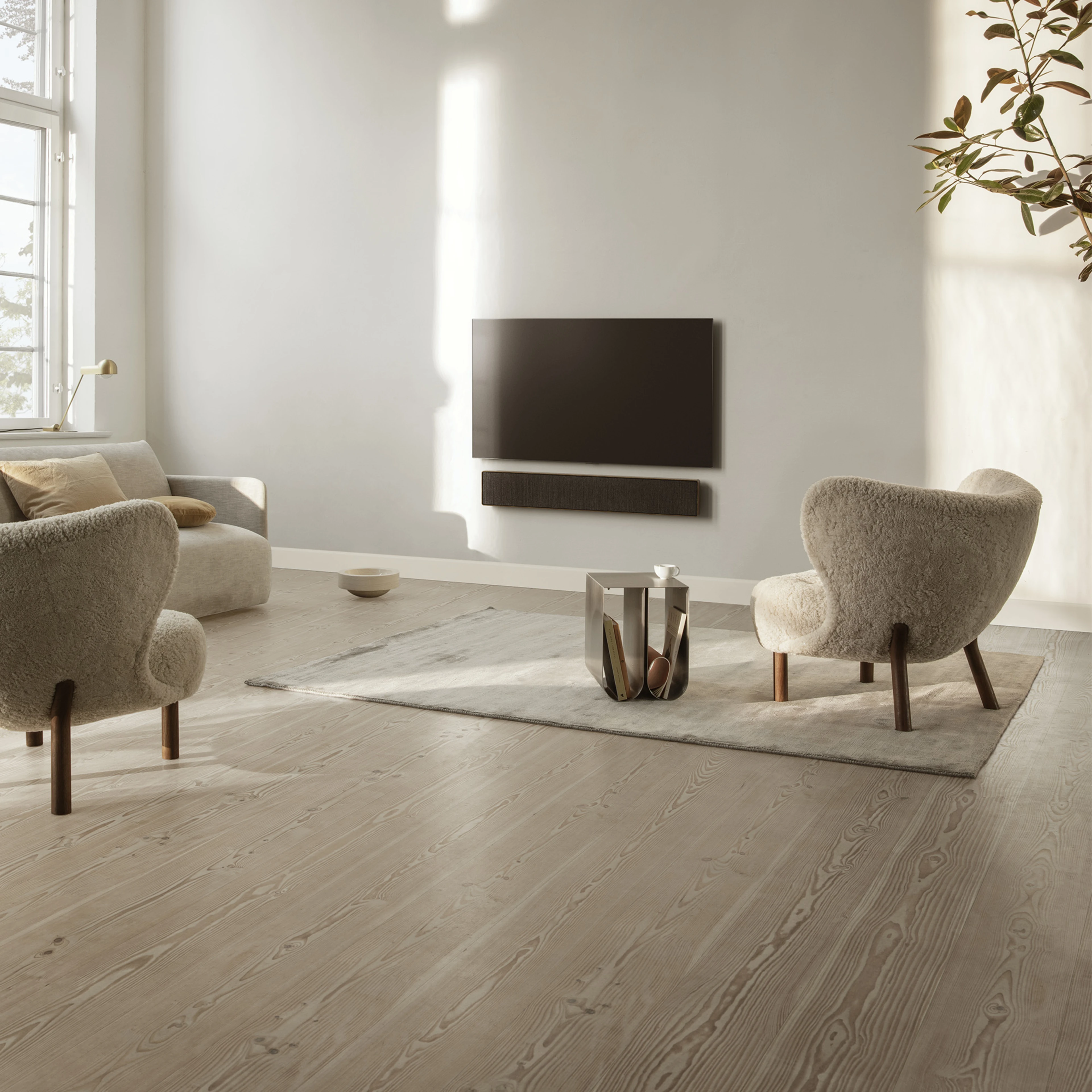 B&O television and soundbar in a living room