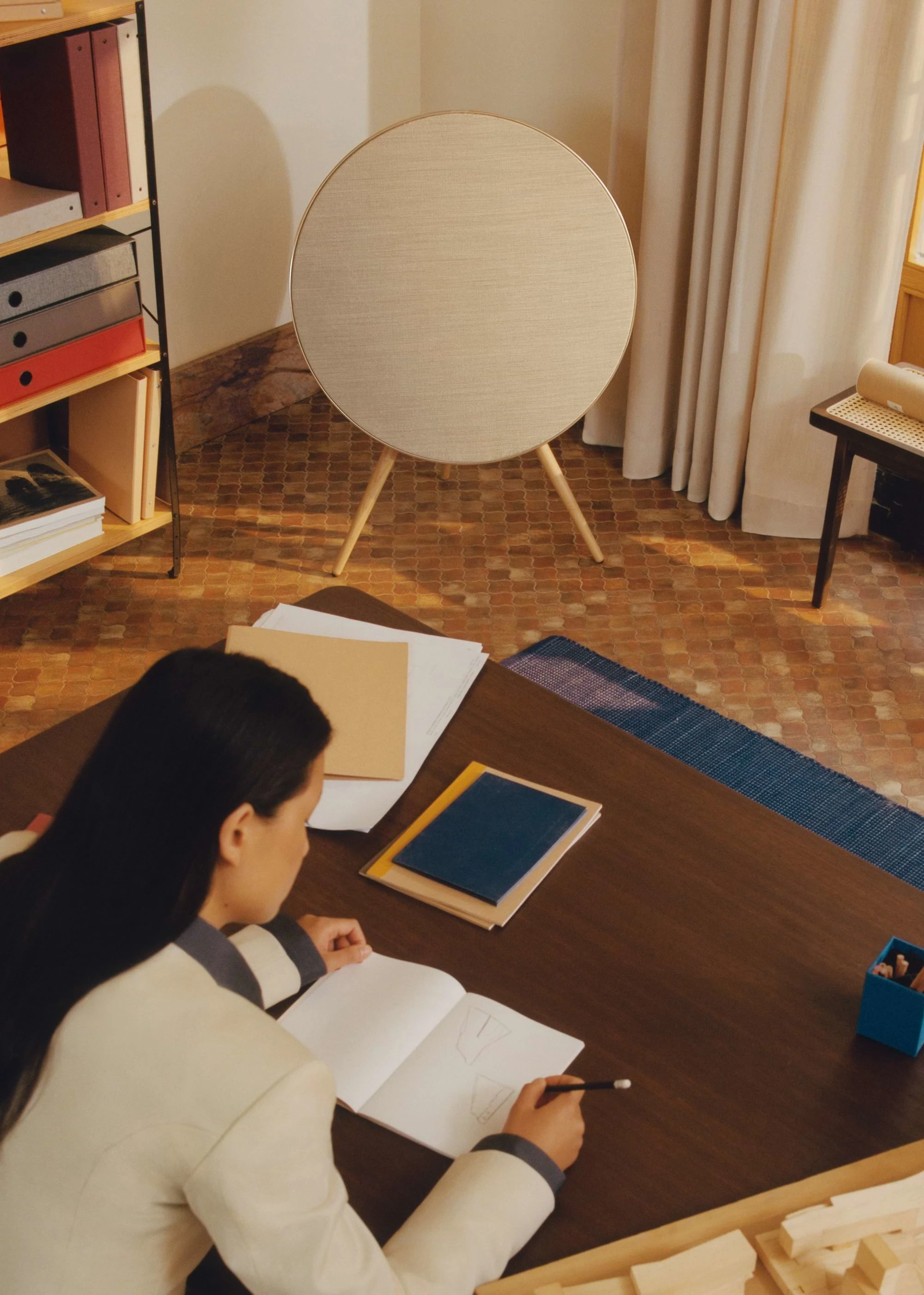 Beosound A9 placed in the corner of a home office