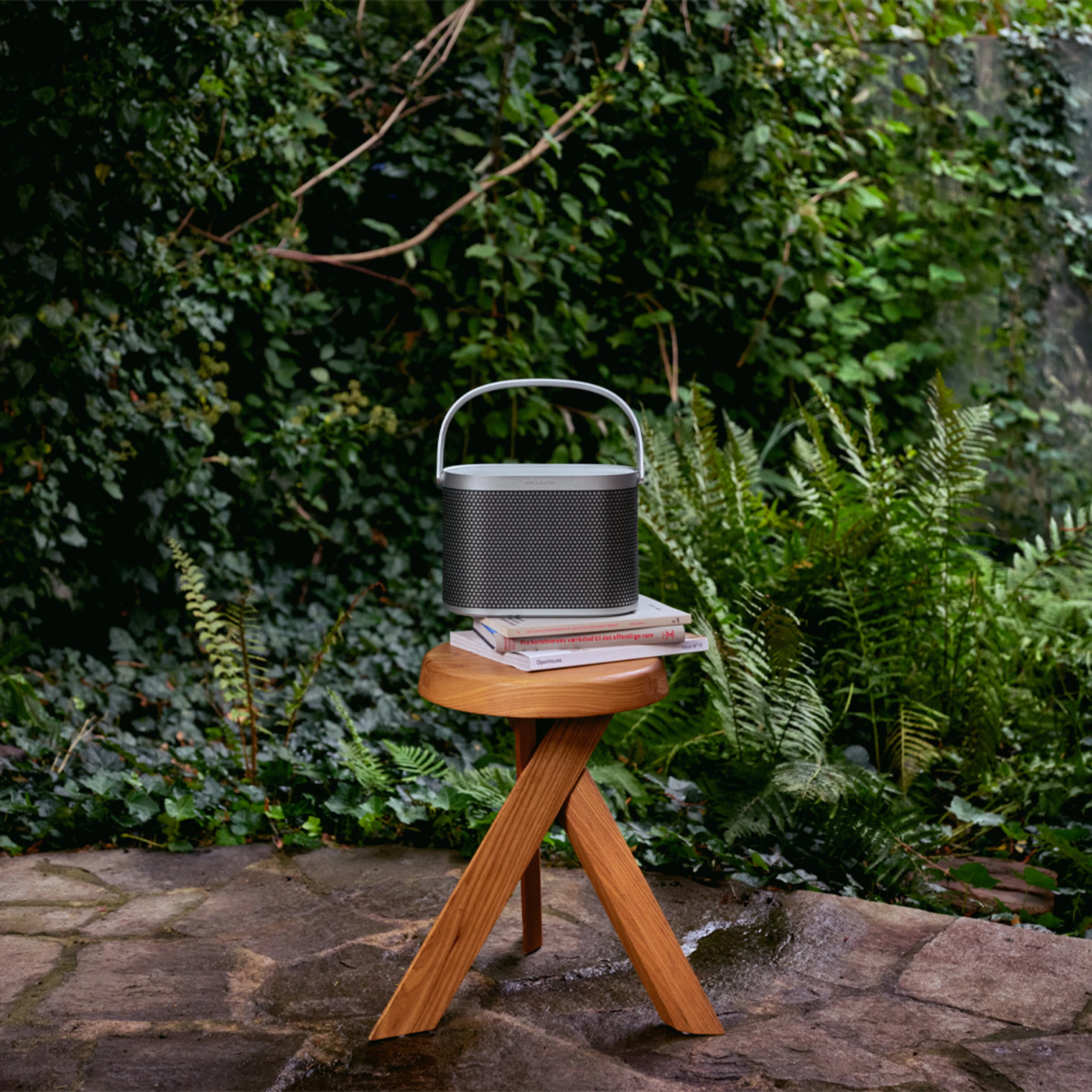 Image of Beosound A5 Spaced Aluminium in Malene and Nikolaj's garden