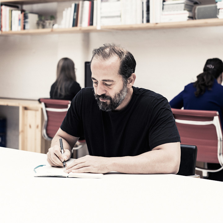 Michael Anastassiades sketching in his office