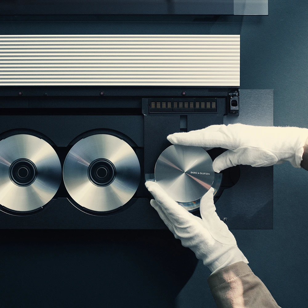 Image with with white glove and CD player