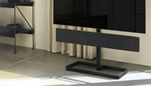 Beosound Stage floor stand accessory with Beosound Stage and a television