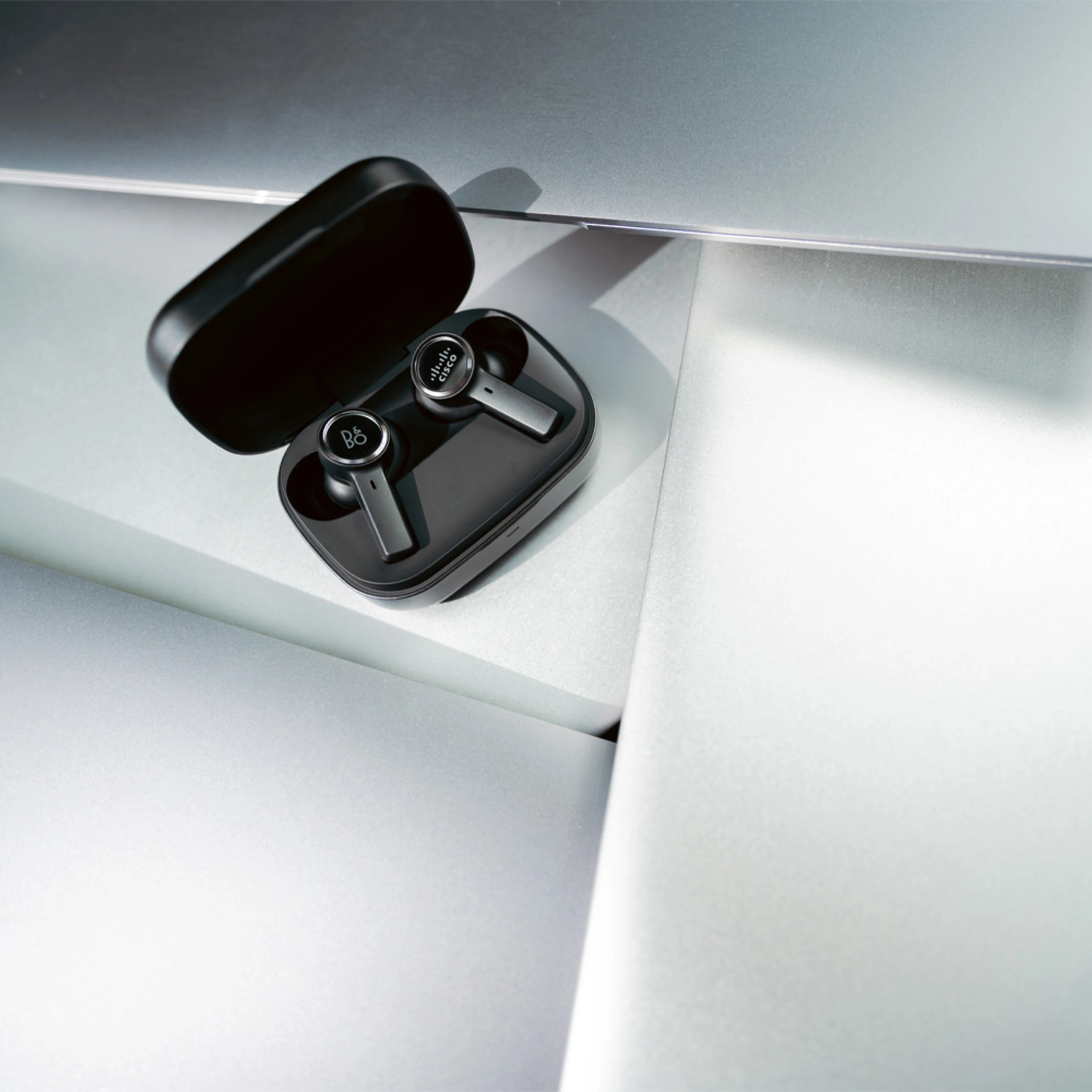 Image of hand holding Beoplay EX