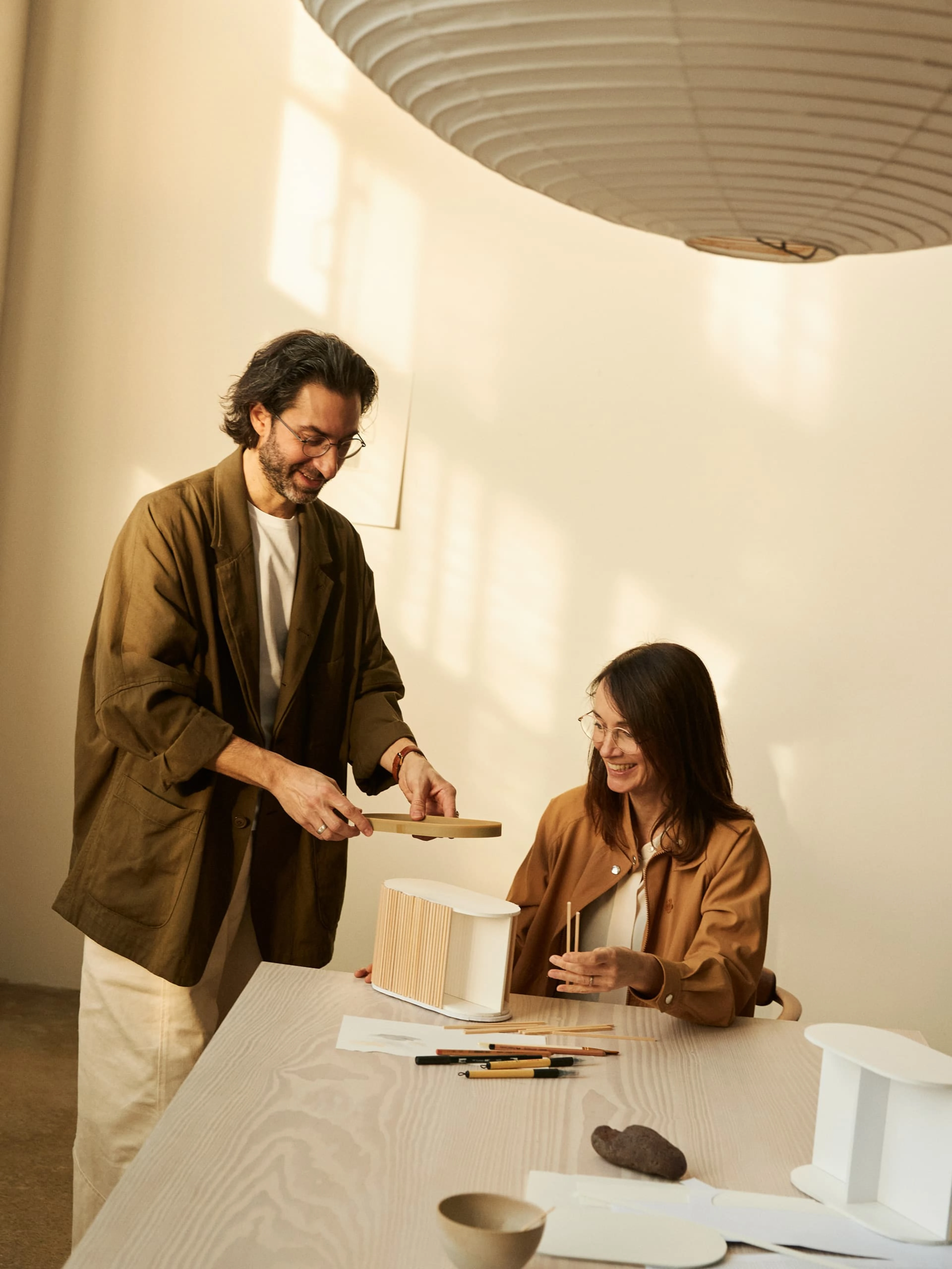 Stine Gam and Enrico Fratesi from GamFratesi Studio with a prototype of the Beosound A5 portable speaker