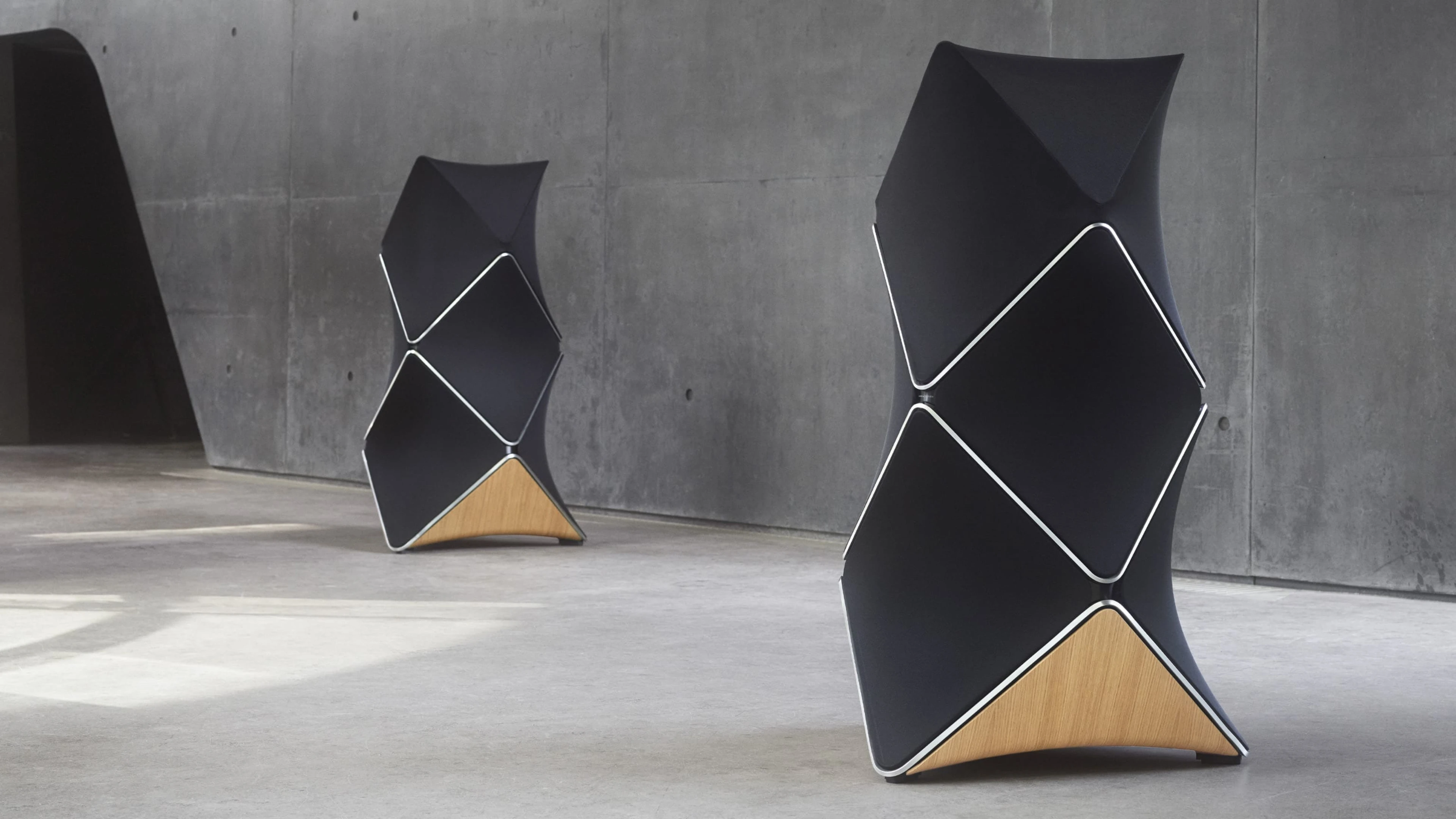 Two Beolab 90 in natural aluminum and black fabric with oak wood