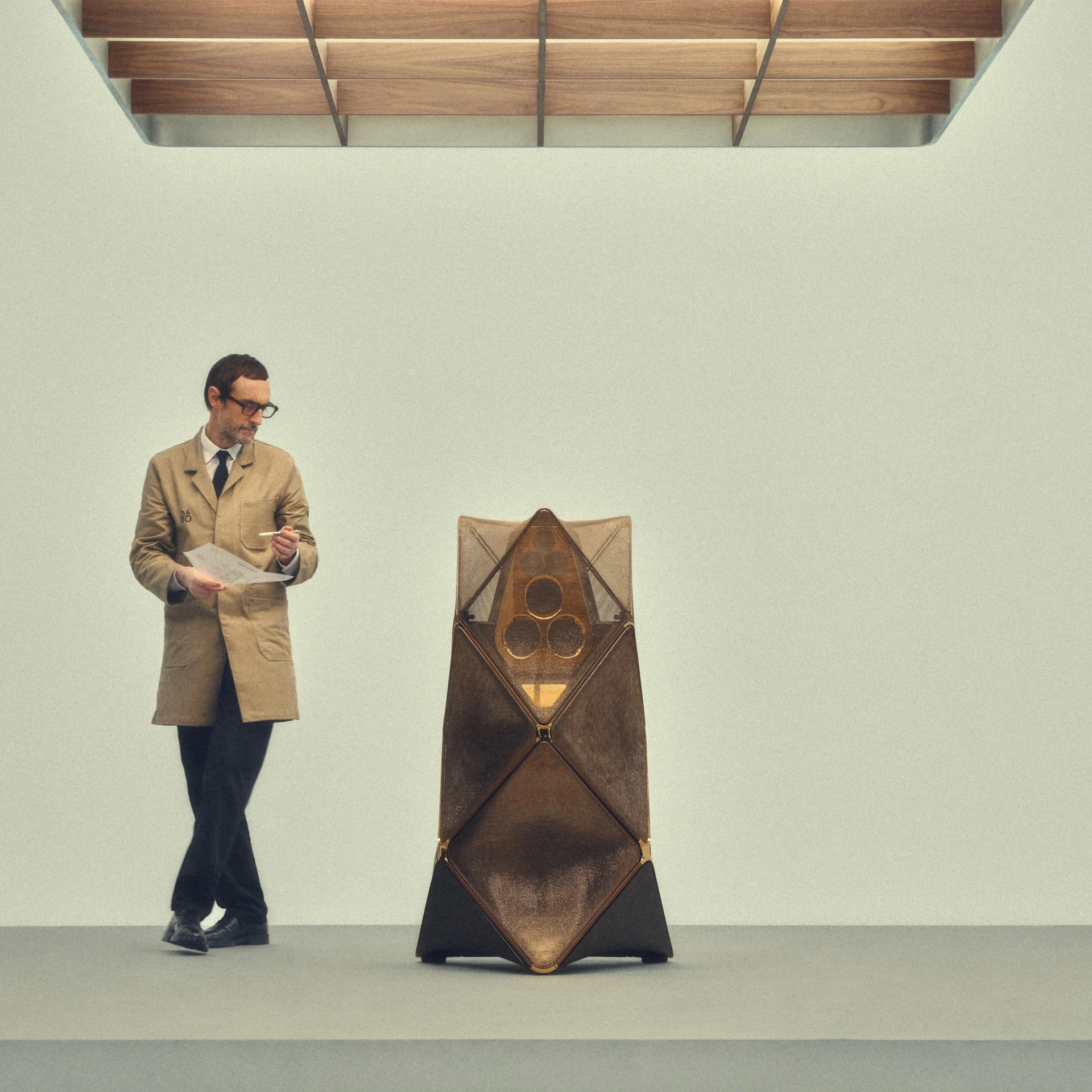Designer standing next to a Beolab 90 speaker, Alchemy limited edition