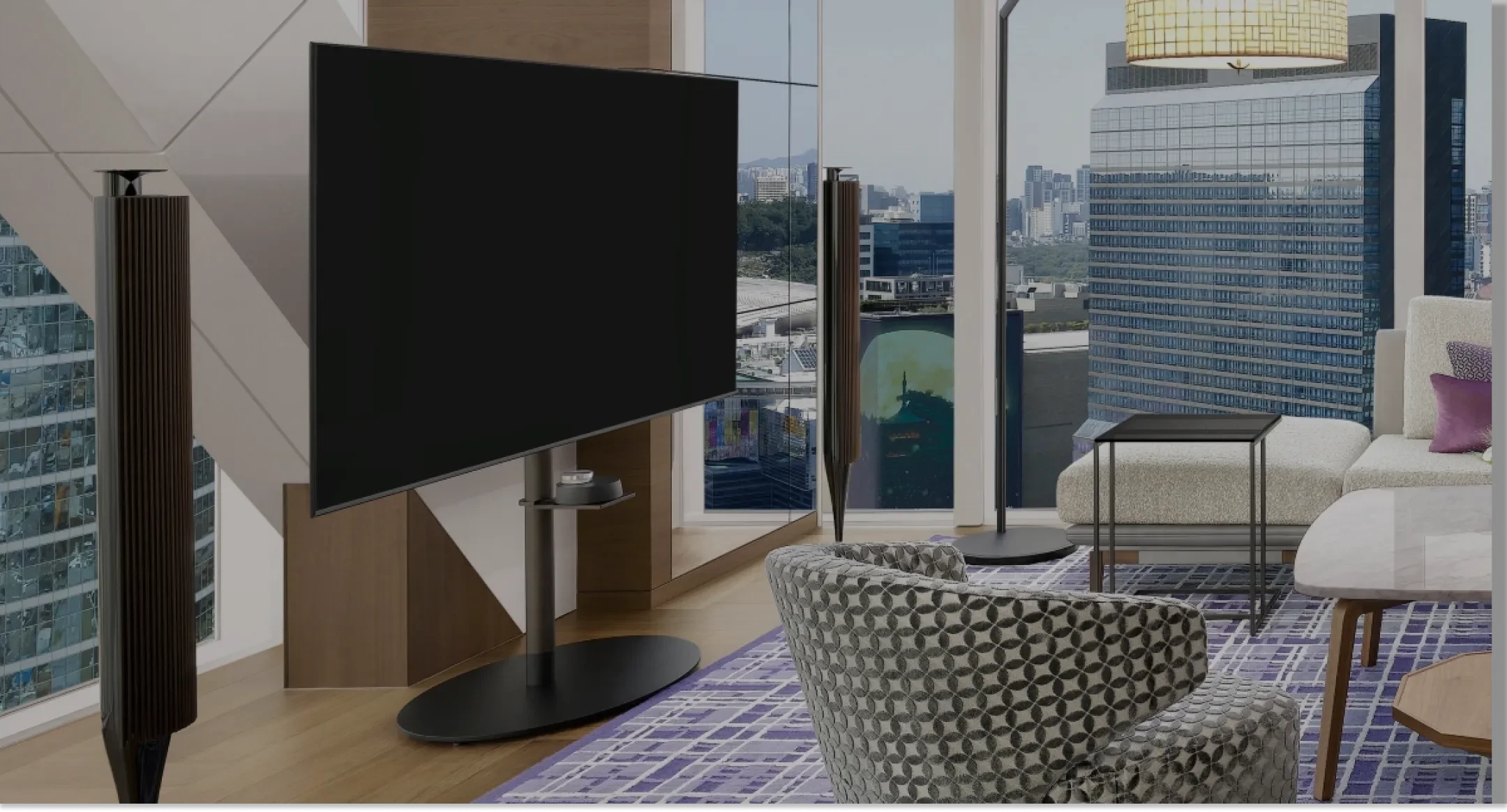 Hotel room with Bang & Olufsen products integrated into the setup