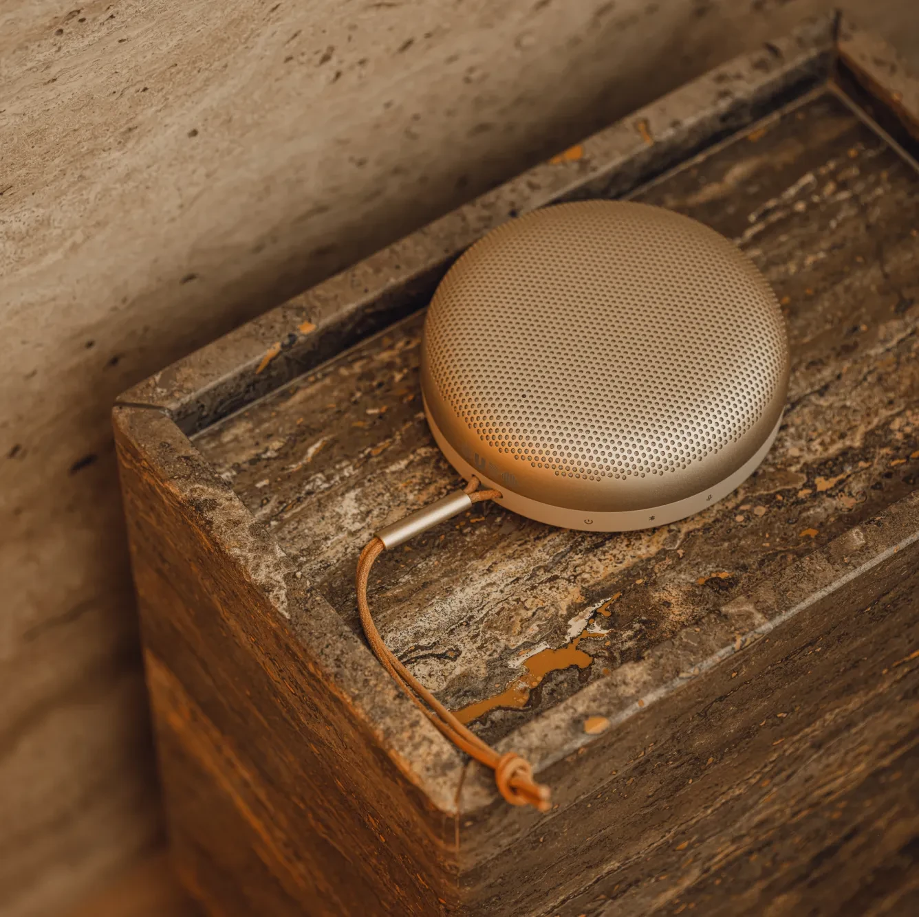Beoplay A1 standing on a marble surface